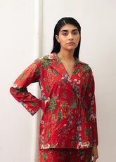 A Women wearing a double-breasted red coat with prints and culottes.
LaRosa Summer Dreams Janessa red cotton nightwear set for women, designed as a bold printed co-ord.
closeup